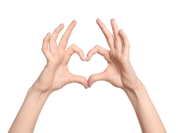 Woman showing heart on white background, closeup of hands - 写真・画像