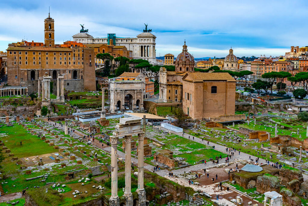 December 4, 2022 - Rome, Italy: Panoramic view over Forum Romanum with ruins of Temple of Saturn, Temple of Castor and Pollux, arches and columns remains. - Photo, Image
