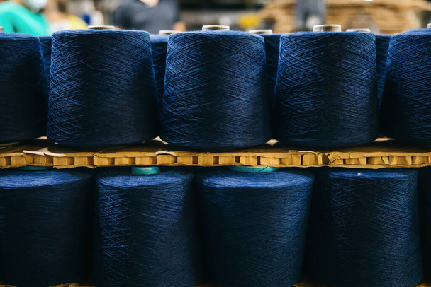 Cotton yarns or threads on spool tube bobbins at cotton yarn factory - Fotoğraf, Görsel