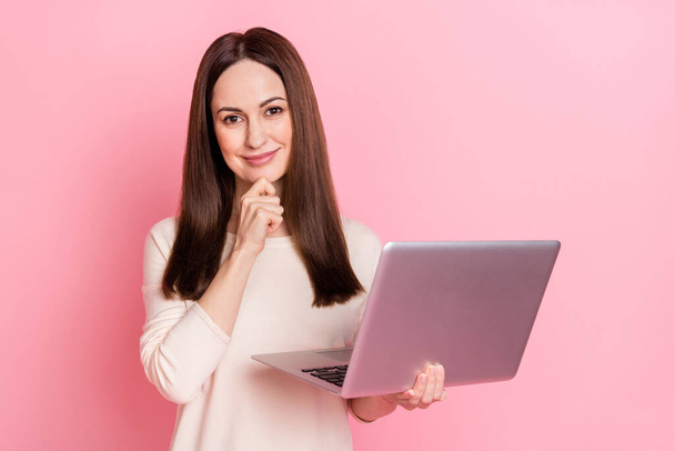 Photo of beautiful intelligent woman hold laptop home based creative job wear pullover isolated pink color background - Foto, imagen