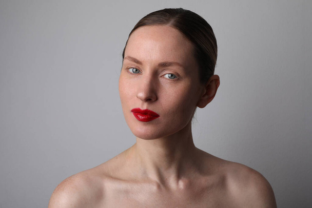 Beauty face. Caucasian woman with glowing skin and natural makeup at studio.  - Фото, зображення