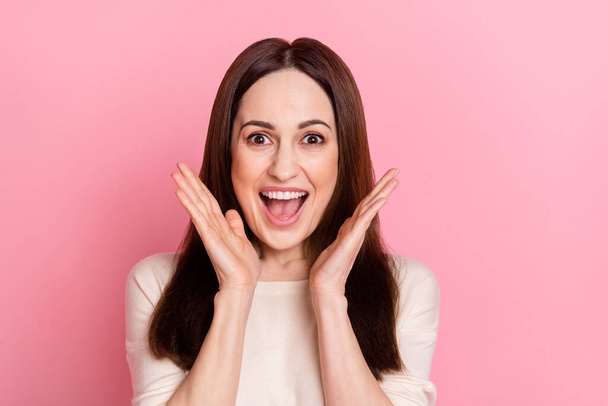 Photo of funny overjoyed yelling lady see big sale banner open mouth wear long sleeve shirt isolated pink pastel color background - 写真・画像