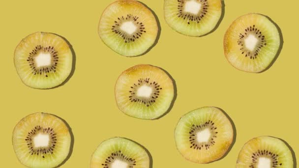 Background of kiwi slices falling. Fresh fruit. Loop. 4K. - Felvétel, videó