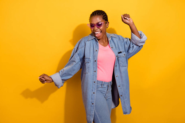 Portrait of satisfied glad girl enjoy free time clubbing good mood isolated on yellow color background - Φωτογραφία, εικόνα