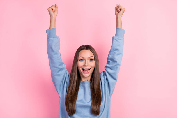 Portrait of attractive lucky cheerful girl having fun rejoicing great news isolated over pink pastel color background - Photo, image
