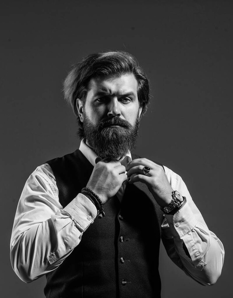 Man serious bearded businessman stylish formal outfit, adjust necktie concept - Фото, изображение