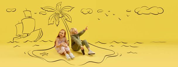 Flyer with funny kids, little boy and girl talking, dreaming isolated on yellow background with drawing, pencil sketch. Inspiration world for kids. Concept of international childrens day - Valokuva, kuva