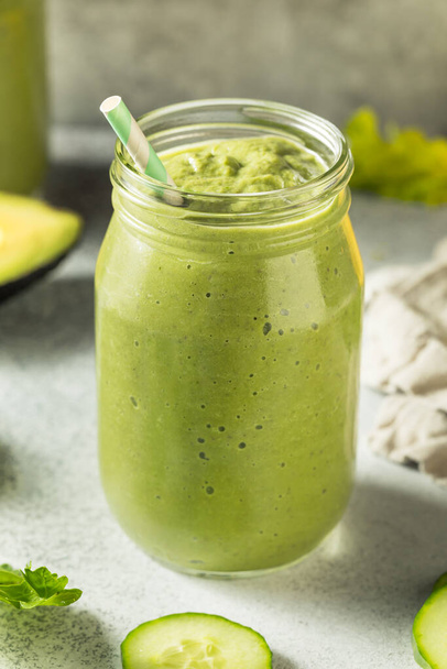 Healthy Organic Detox Green Smoothie with Kale Spinach and Cucumbers - Photo, Image