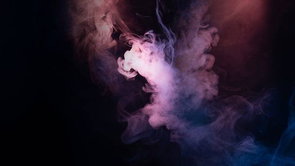 Blue and pink steam on a black background. Copy space. - Fotó, kép