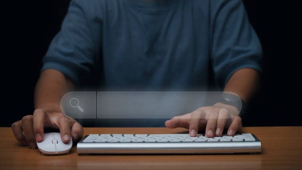 Man hands using a computer keyboard to searching for information data on internet networking. Search Engine Optimization SEO networking concept.  - Photo, Image