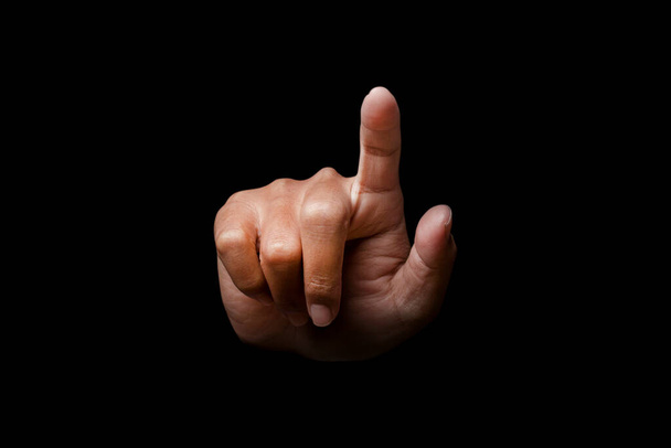 Hand finger pointing isolated on black background. clipping path. - Foto, immagini