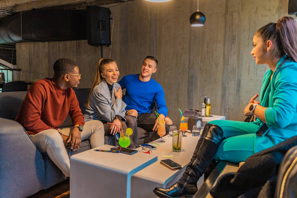 Group of multiracial best friends are smiling and talking to each other - Valokuva, kuva