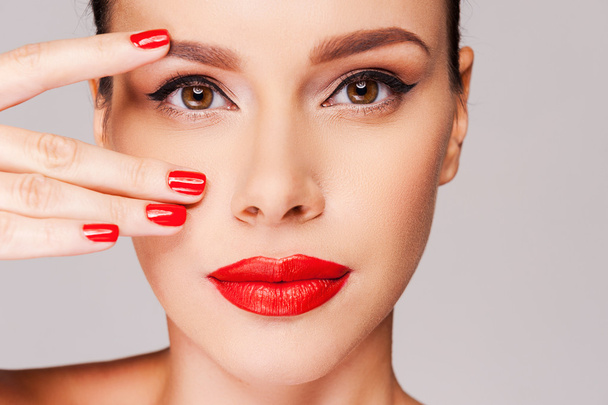 Beautiful woman with red manicure - Фото, изображение