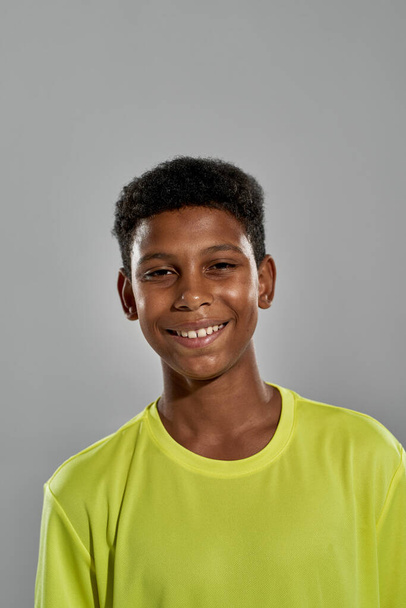 Partial image of smiling black boy look at camera - Photo, Image