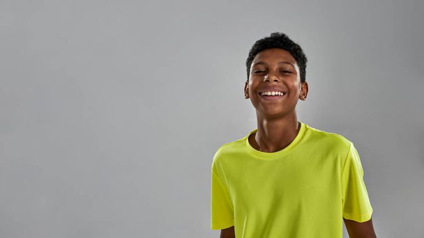 Partial image of smiling black boy look at camera - Foto, afbeelding