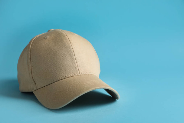 Baseball cap on light blue background, space for text - Photo, Image