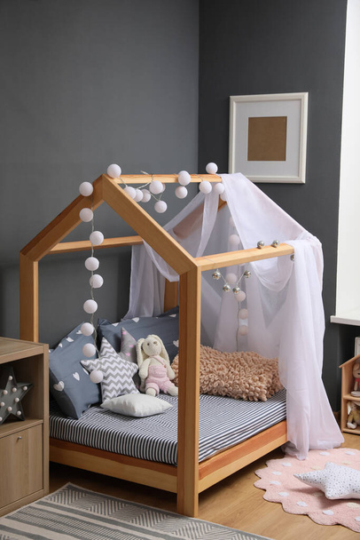 Stylish child room interior with comfortable bed - Zdjęcie, obraz