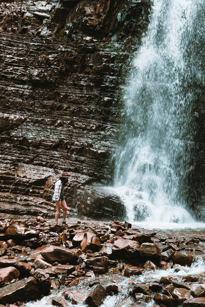 woman traveler enjoying view of waterfall copy space - Photo, Image