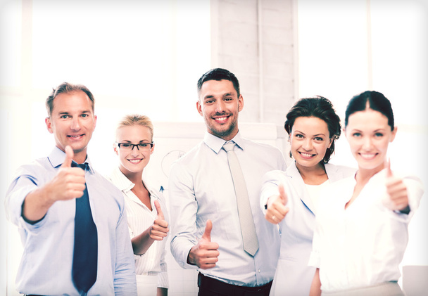 business team showing thumbs up in office - Photo, Image