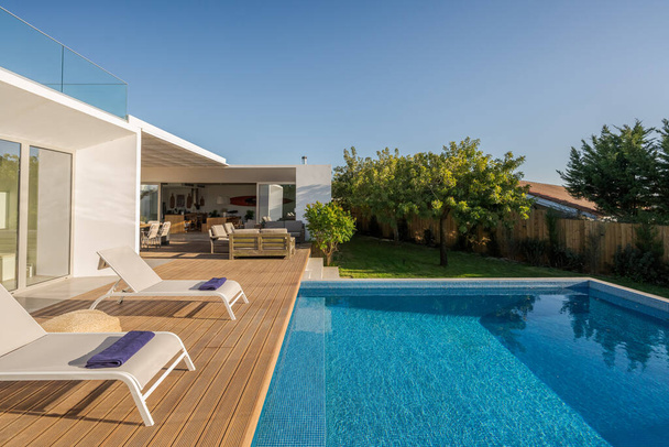 Modern villa with pool and deck with interior and exterior views - Φωτογραφία, εικόνα