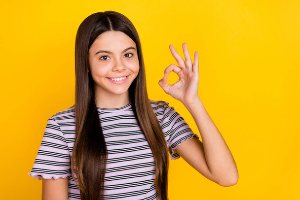 Photo of young adorable lady show okey symbol promo decision perfect isolated over yellow color background - Fotoğraf, Görsel