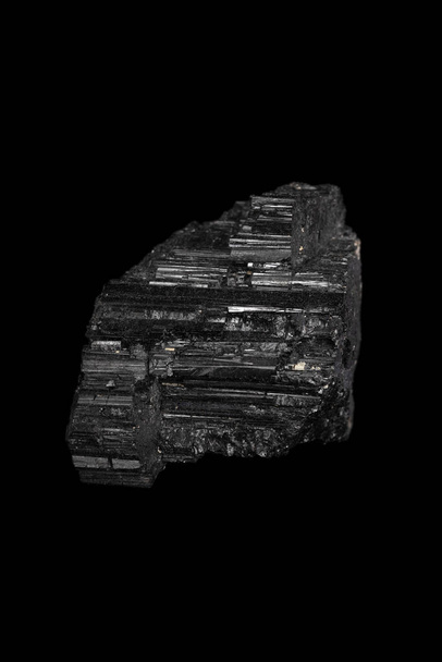 Black Tourmaline mineral, gemstone on black background. - Foto, Imagen