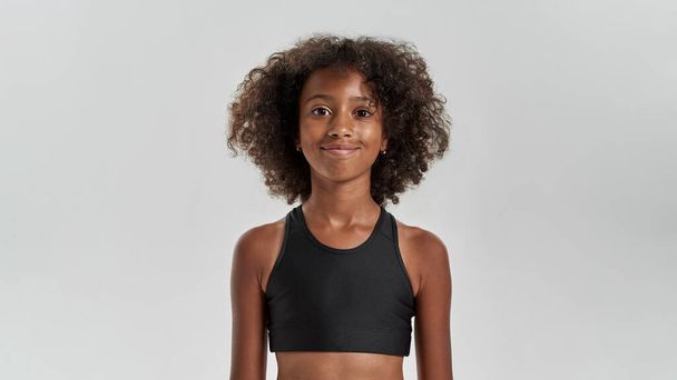 Cropped image of smiling black girl look at camera - Foto, immagini