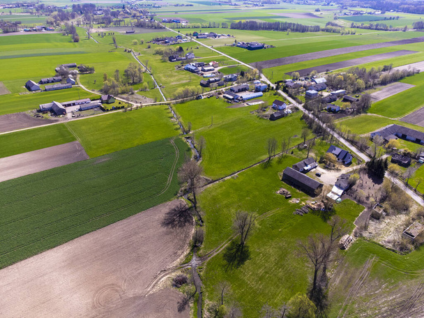 Spring fields, meadows and villages seen from a bird's eye view on a sunny, clear day. - Foto, Bild