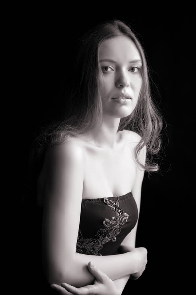 Portrait of beautiful sexy girl on a black background - Фото, зображення