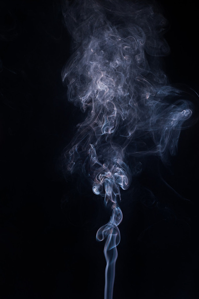 Abstract smoke moves on a black background - Foto, afbeelding