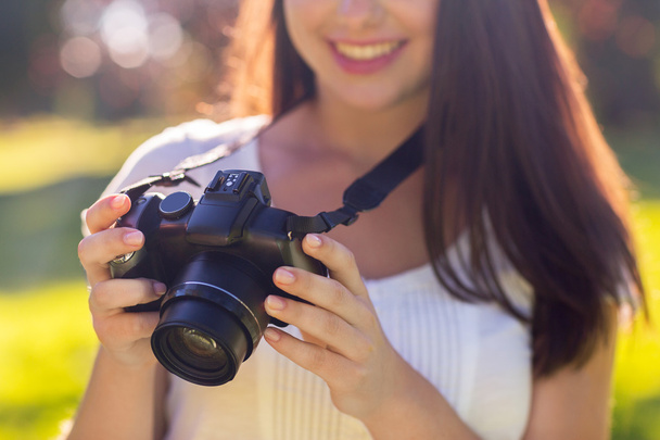 close up of young girl with photo camera outdoors - Fotoğraf, Görsel