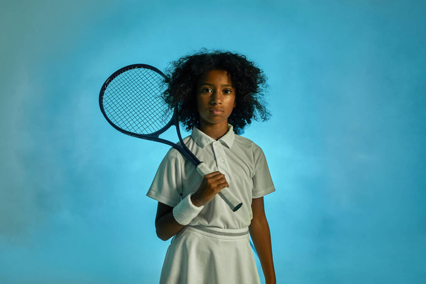 Front view of black girl tennis player with racket - Photo, image