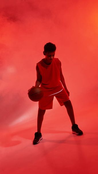African boy basketball player dribbling with ball - Valokuva, kuva