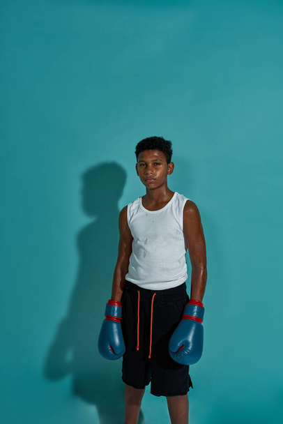 Front view of black boy boxer looking at camera - Fotó, kép