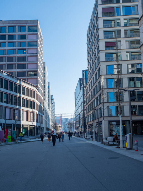 Zurich, Switzerland - March 5th 2022: Modern building blocks and asphalt desert in Europaallee - Фото, изображение