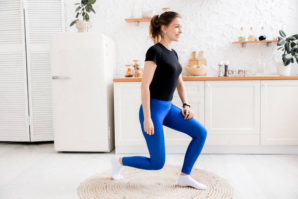 young woman doing yoga exercises at home - Valokuva, kuva
