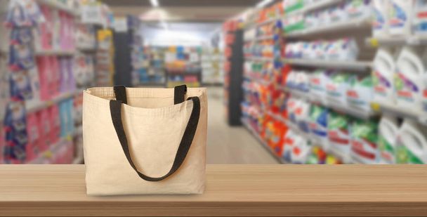 empty shopping bag in front of supermarket background - Fotografie, Obrázek