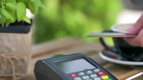 NFC credit card payment. Woman paying with contactless credit card with NFC technology. Wireless money transaction. Wireless payment - Footage, Video