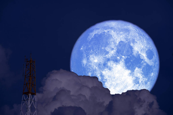 Full Snow Moon on night sky back cloud silhouette signal pole, Elements of this image furnished by NASA - Foto, Bild