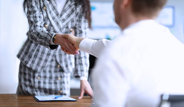 Business partners shaking hands after making good deal - Foto, Bild