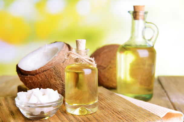 Coconut oil on table on light background - Foto, Imagem