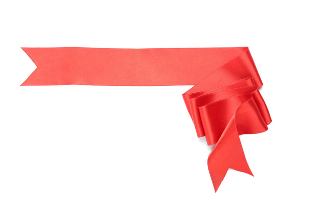Beautiful red ribbon isolated on white, top view - Foto, immagini