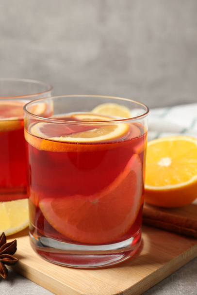 Aromatic punch drink and ingredients on table - Photo, image