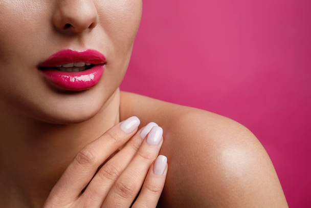 Closeup view of woman with beautiful lips on pink background. Space for text - Foto, Bild