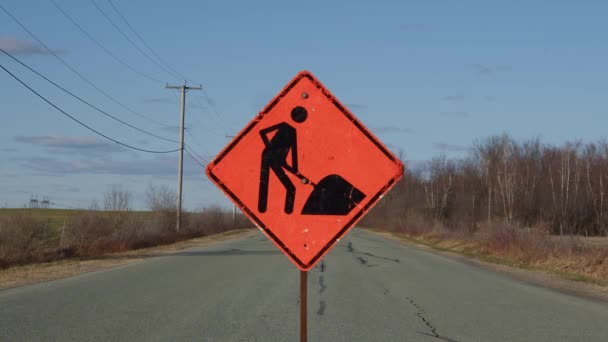 construction orange traffic sign on rural road clouds time lapse - Footage, Video