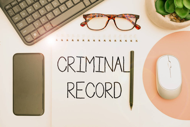 Inspiration showing sign Criminal Record. Word for profile of a person criminal history with details Office Supplies Over Desk With Keyboard And Glasses And Coffee Cup For Working - Photo, Image