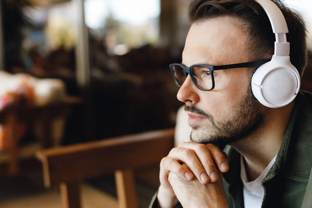 handsome man with headphones indoor - Photo, image