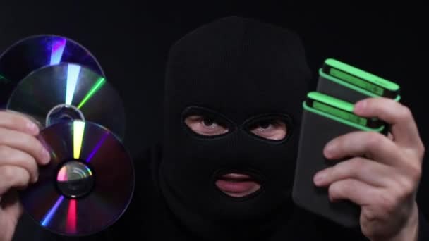 Highly dangerous hacker. A man with a masked face speaks into the camera. - Footage, Video