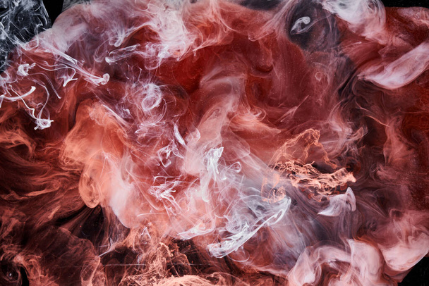 Multicolor pink smoke on black ink background, colorful fog, abstract swirling touch ocean sea, acrylic paint pigment underwater - Fotoğraf, Görsel