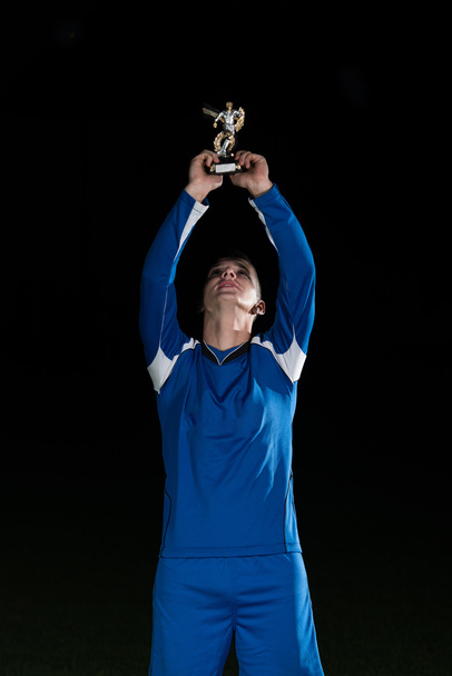 Soccer Player Celebrating Victory While Holding Win Coup - Fotografie, Obrázek